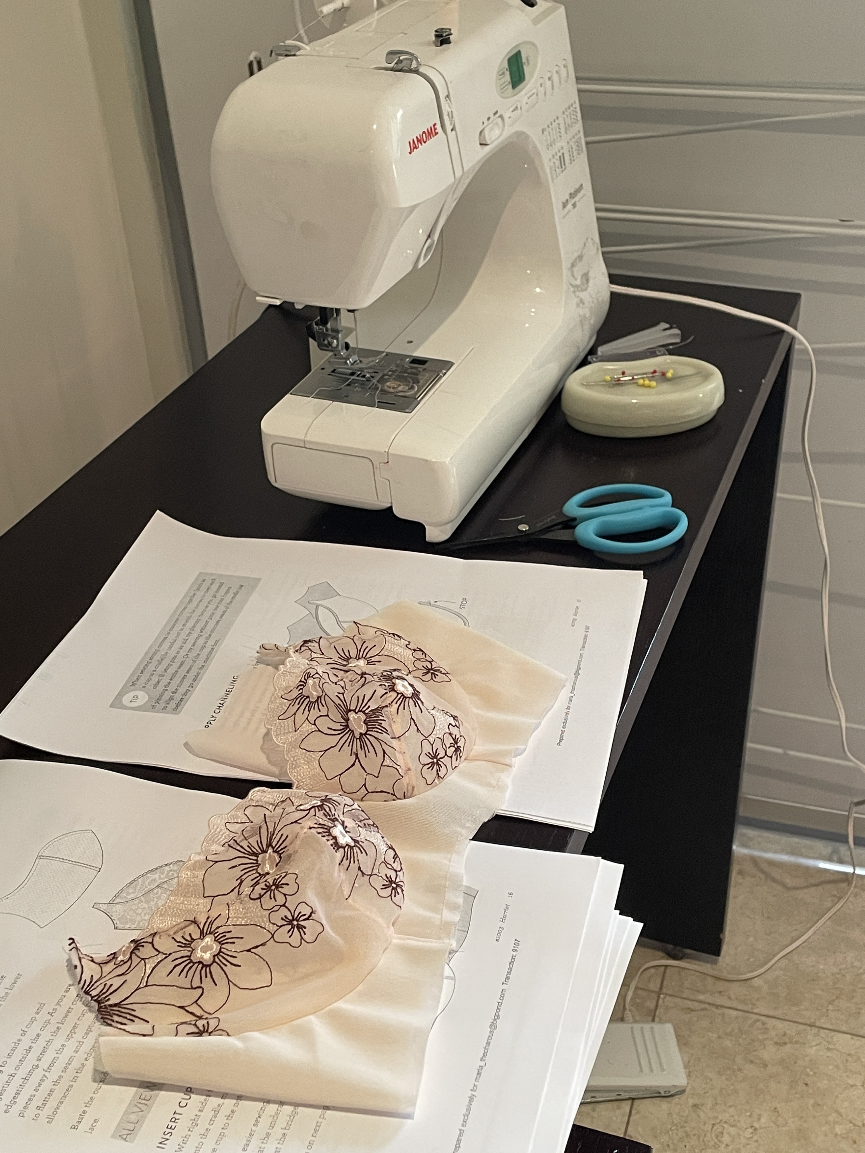 Machine with bra project and instructions set up in a hotel room